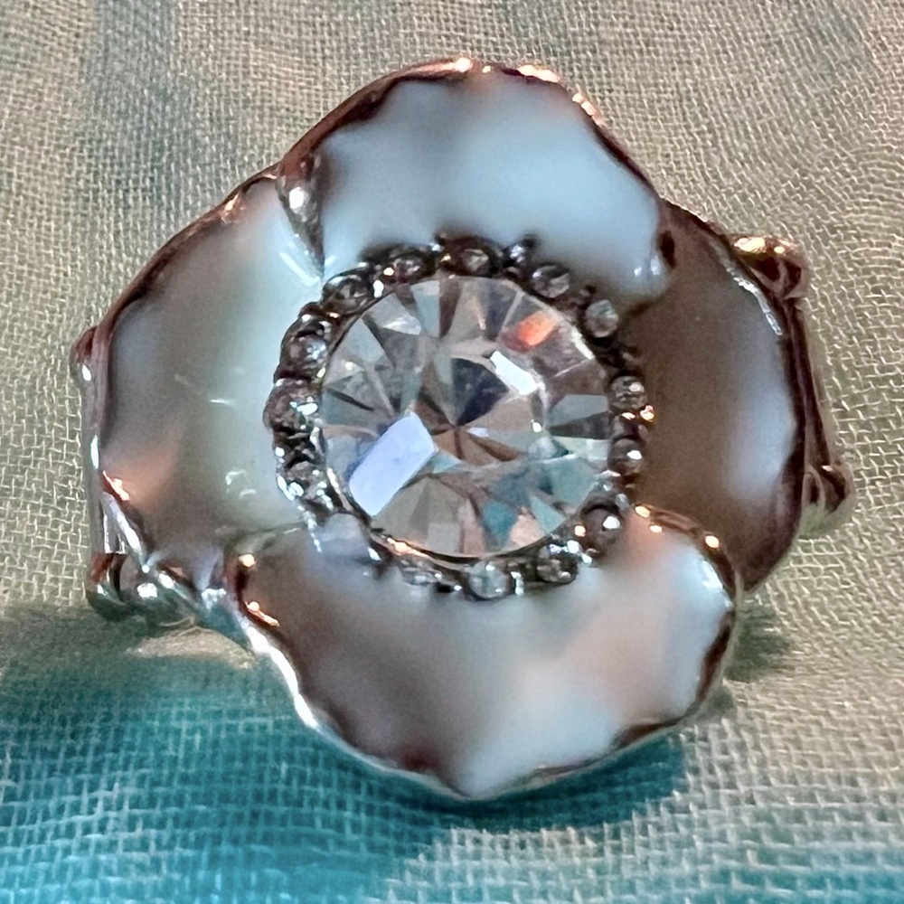 Expandable to fit most. This flower ring is delightful